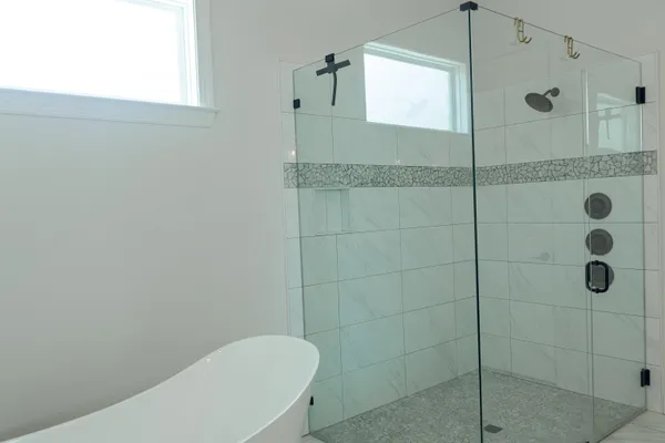 a bathroom with a sink a light fixture and a mirror