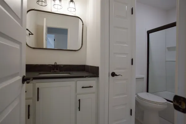 a view of an empty room with a window