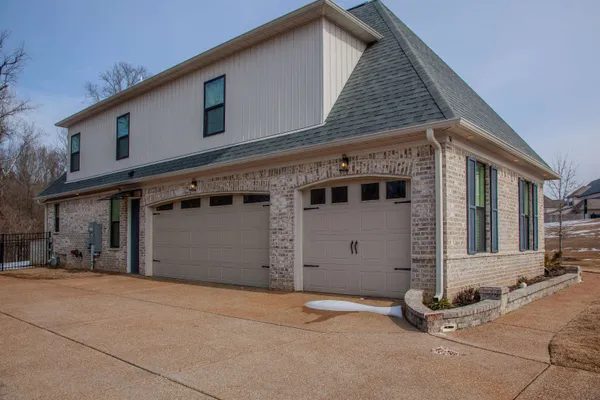 a front view of a house with garage