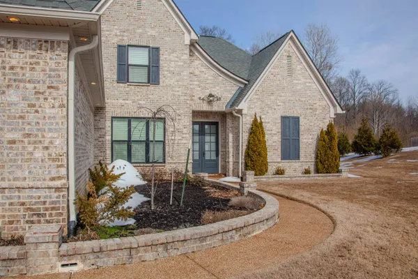 a view of a house with outdoor seating