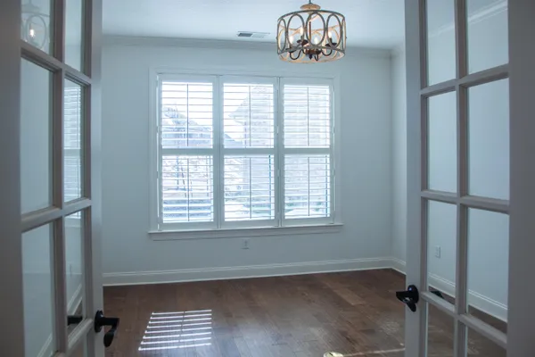 a view of an empty room and a window