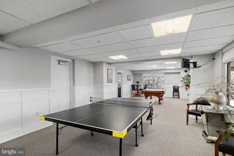 a room with lots of furniture and a table