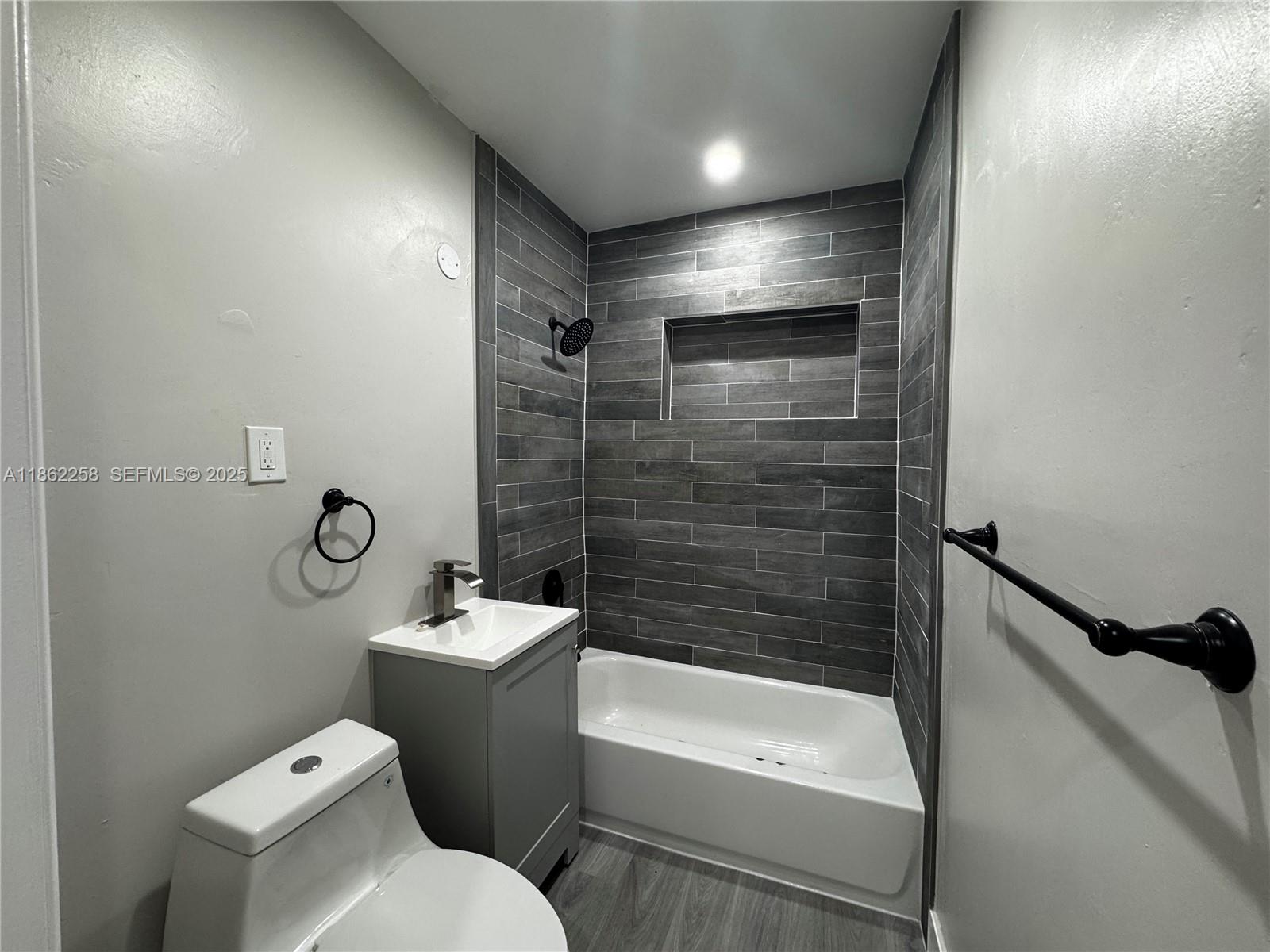 2377 Northwest 35th Street, Unit UTILITIES Miami, FL 33142 - Photo 2 of 9 a bathroom with a sink a toilet and shower