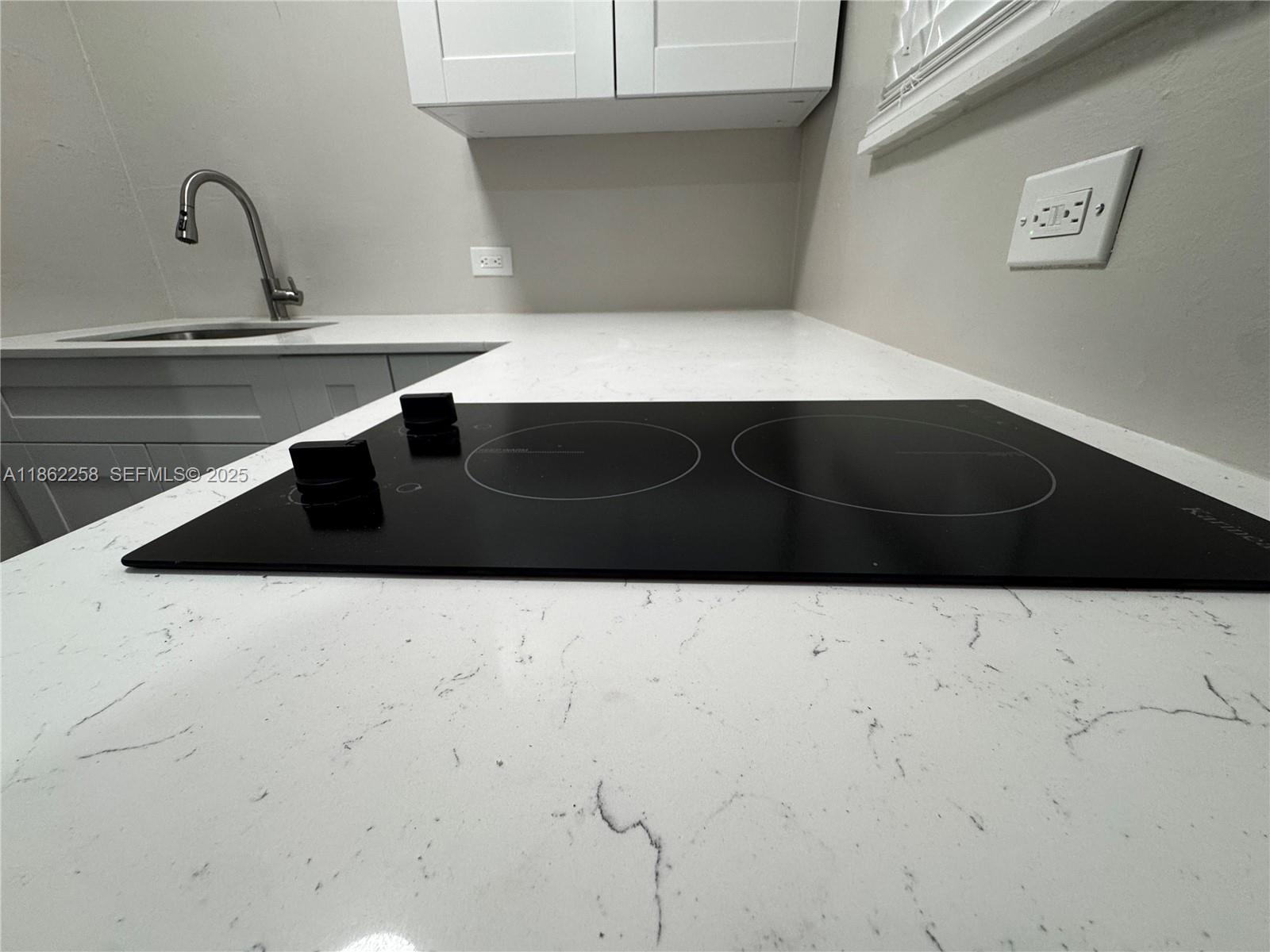 2377 Northwest 35th Street, Unit UTILITIES Miami, FL 33142 - Photo 4 of 9 a bathroom with a sink and a stove