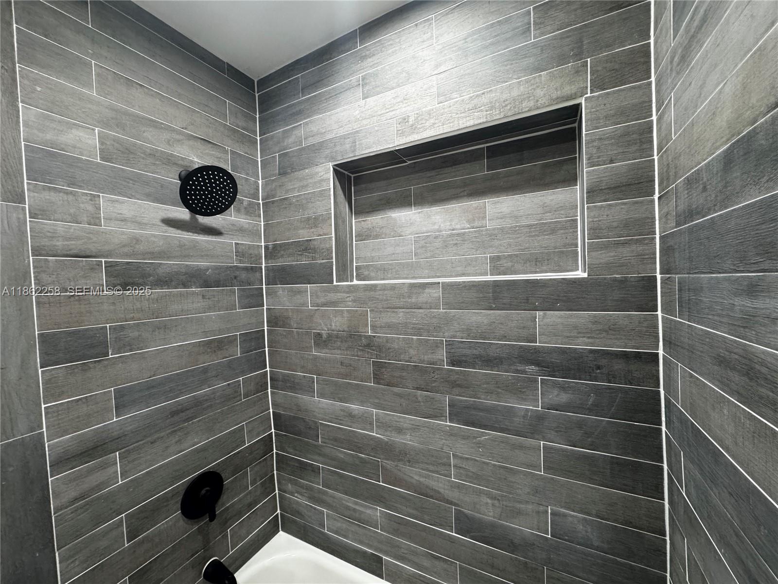 2377 Northwest 35th Street, Unit UTILITIES Miami, FL 33142 - Photo 7 of 9 a bathroom with a shower