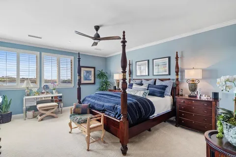 a spacious bedroom with a bed and furniture