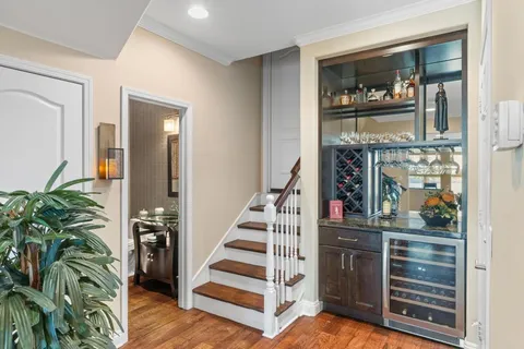 a view of a hallway with entryway and furniture