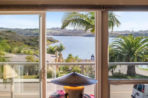 a view of a glass door with a balcony