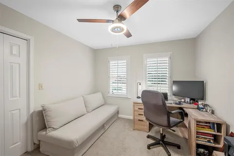 a work room with furniture and a window
