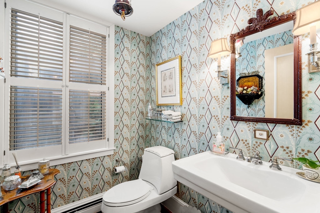 228 Allandale Road, Unit 1A Boston, MA 02467 - Photo 16 of 17 a bathroom with a sink toilet and shower