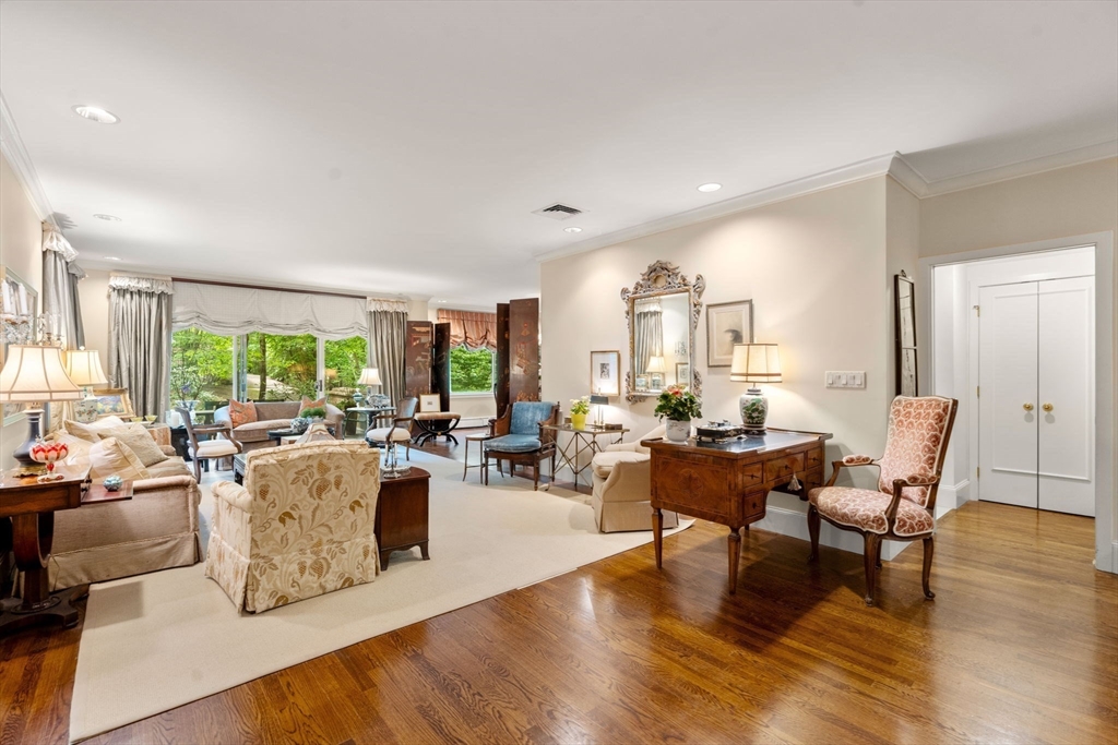 228 Allandale Road, Unit 1A Boston, MA 02467 - Photo 3 of 17 a living room with fireplace furniture and a large window
