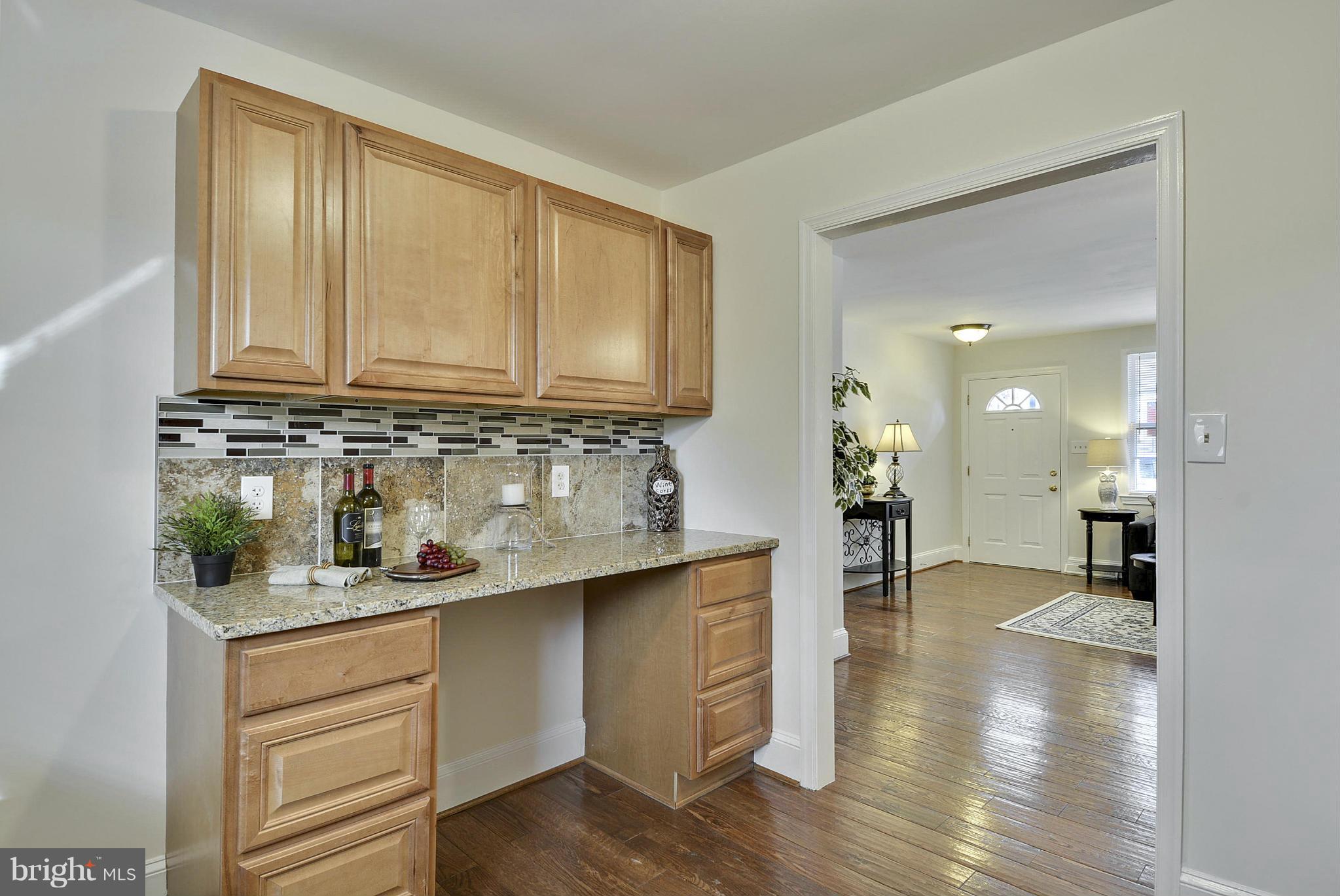 106 Harmony Hall Road Gaithersburg, MD 20877 - Photo 11 of 30 a kitchen with a refrigerator and cabinets
