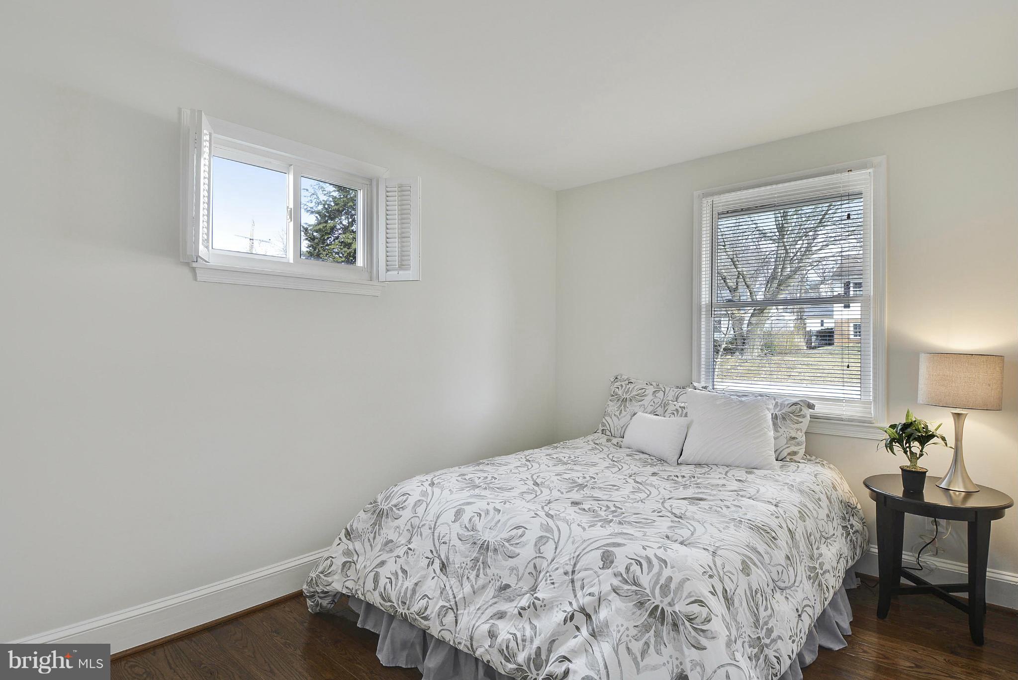 106 Harmony Hall Road Gaithersburg, MD 20877 - Photo 14 of 30 a bedroom with a bed and a window