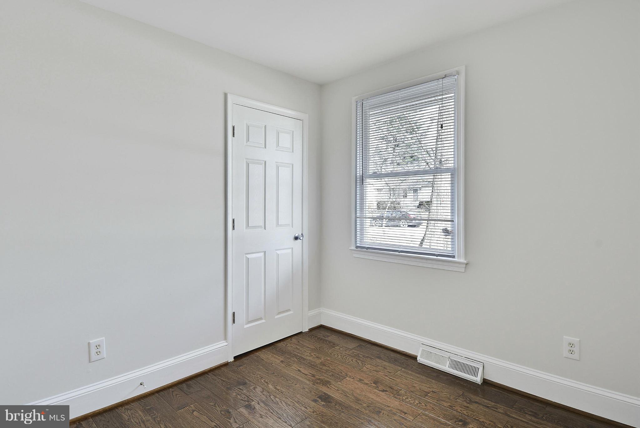 106 Harmony Hall Road Gaithersburg, MD 20877 - Photo 15 of 30 an empty room with wooden floor and windows