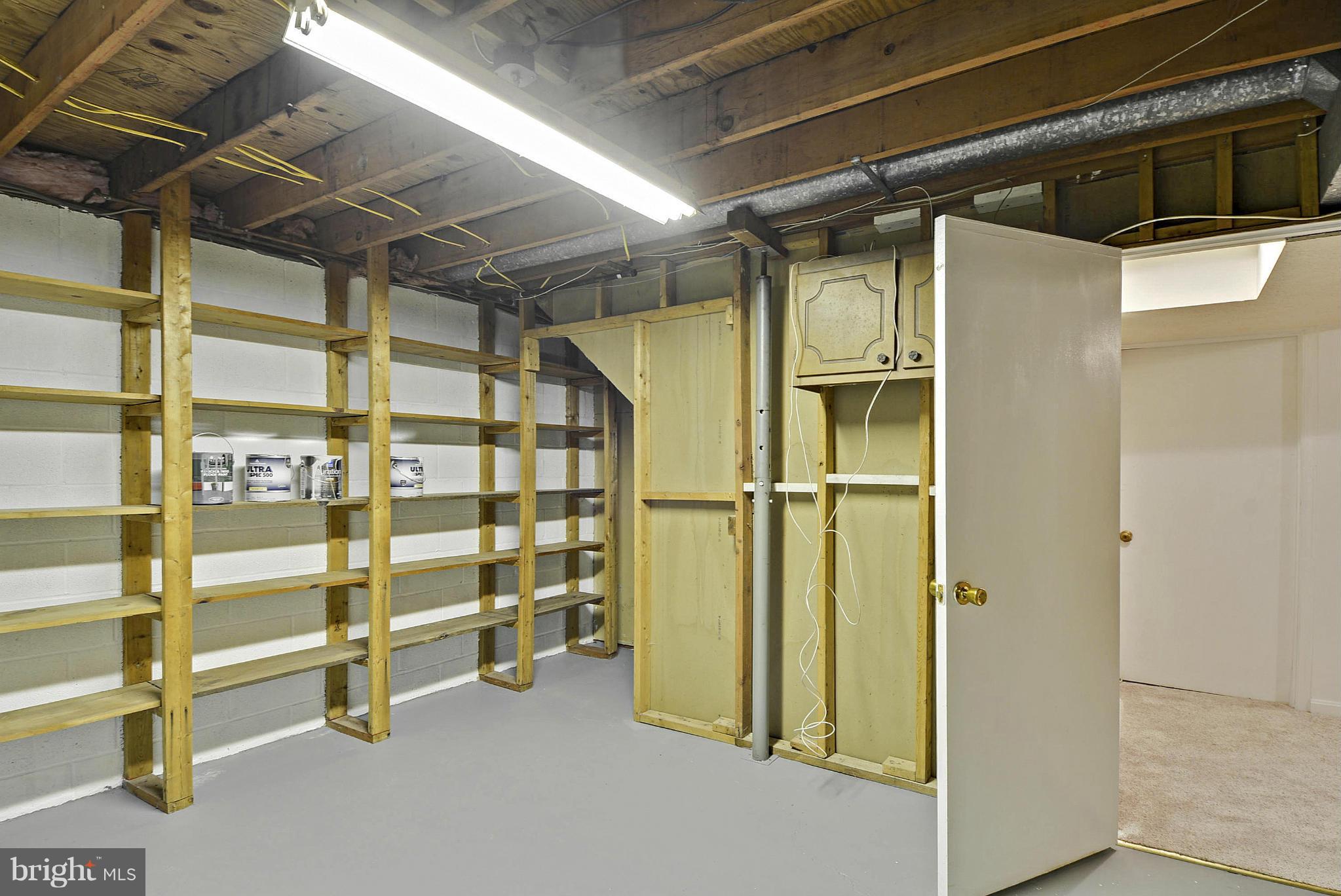 106 Harmony Hall Road Gaithersburg, MD 20877 - Photo 20 of 30 a view of an empty room with wooden shelves