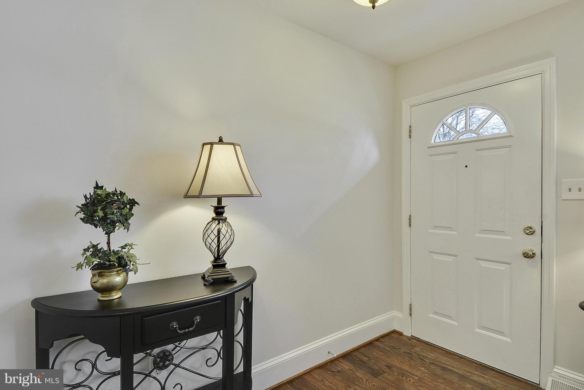 106 Harmony Hall Road Gaithersburg, MD 20877 - Photo 3 of 30 a view of room with a table and wooden floor