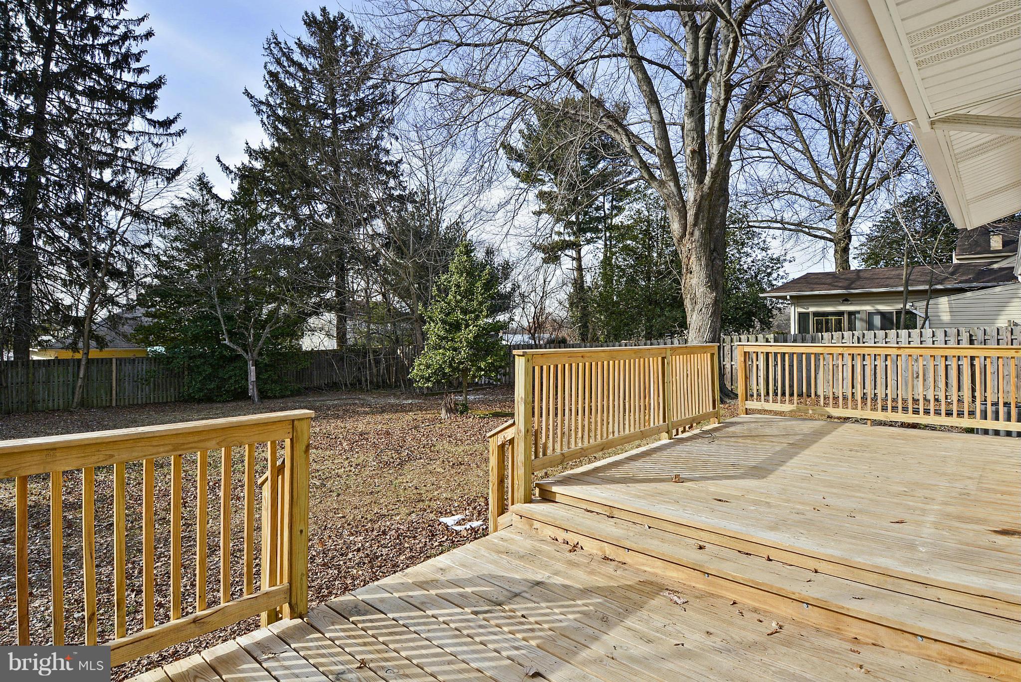 106 Harmony Hall Road Gaithersburg, MD 20877 - Photo 22 of 30 a view of a deck with a large trees