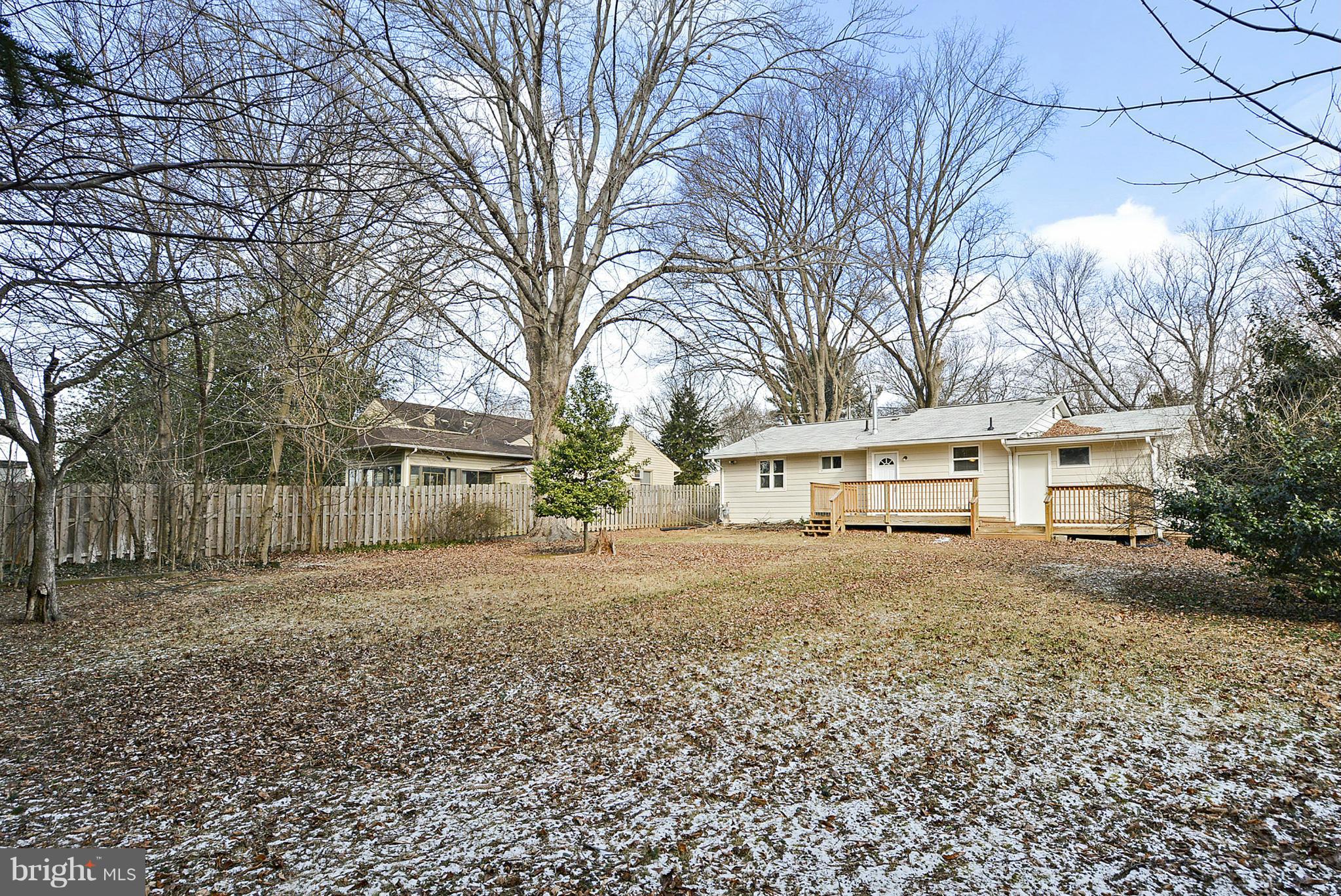 106 Harmony Hall Road Gaithersburg, MD 20877 - Photo 24 of 30 a view of a house with a yard covered in the tree