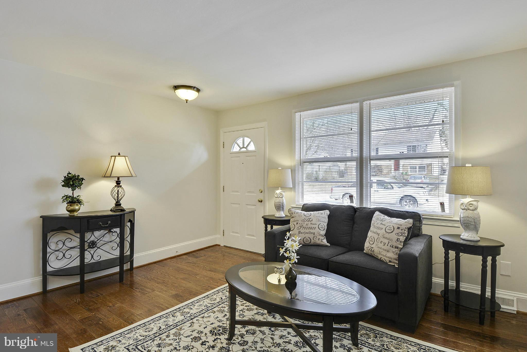 106 Harmony Hall Road Gaithersburg, MD 20877 - Photo 4 of 30 a living room with furniture and wooden floor