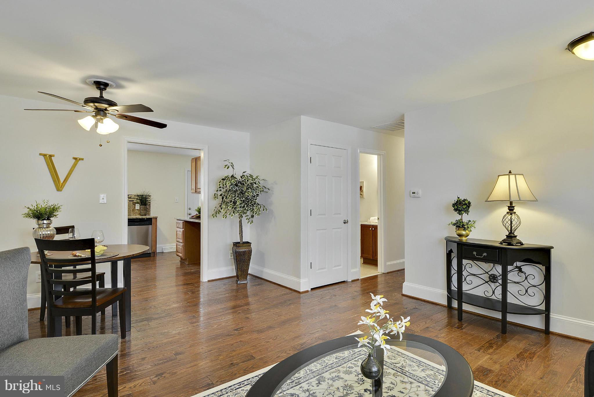 106 Harmony Hall Road Gaithersburg, MD 20877 - Photo 6 of 30 a living room with furniture and wooden floor