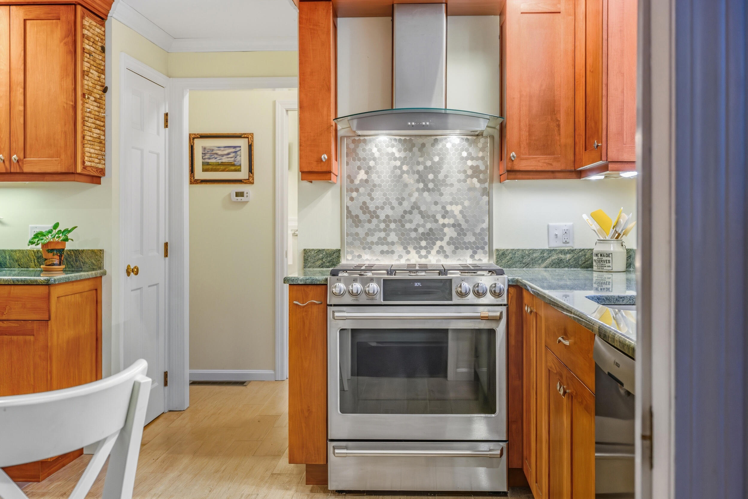 28 Lakeview Avenue Chatham, MA 02633 - Photo 14 of 63 a kitchen with stainless steel appliances granite countertop a stove and a refrigerator