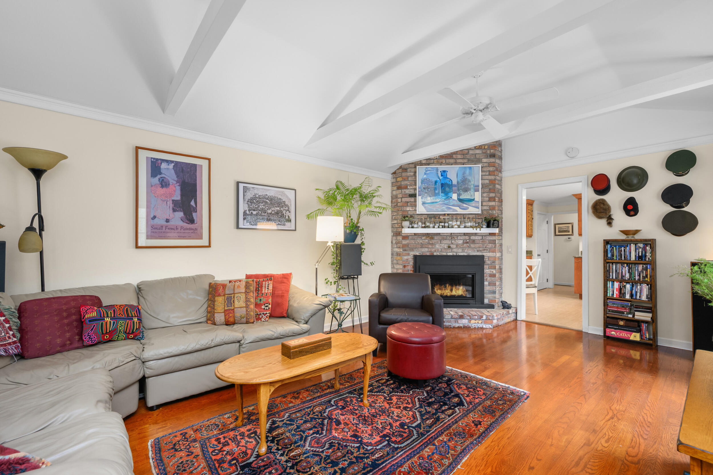 28 Lakeview Avenue Chatham, MA 02633 - Photo 17 of 63 a living room with furniture a fireplace and wall paintings