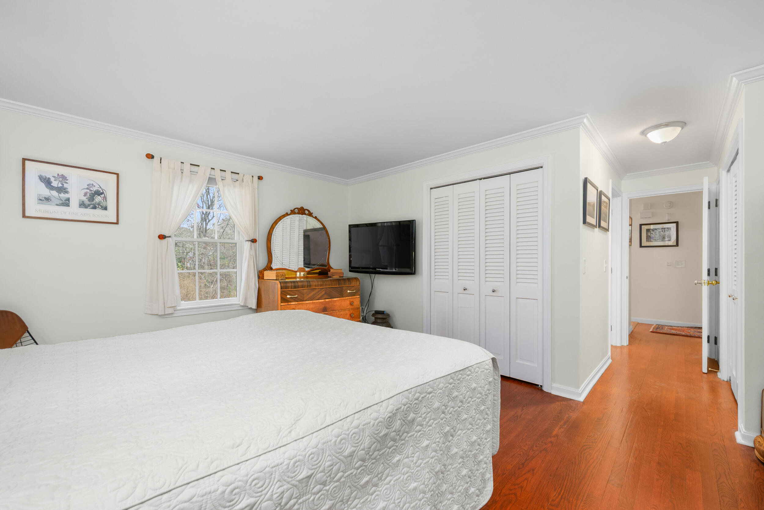 28 Lakeview Avenue Chatham, MA 02633 - Photo 22 of 63 a bedroom with a bed and a flat screen tv