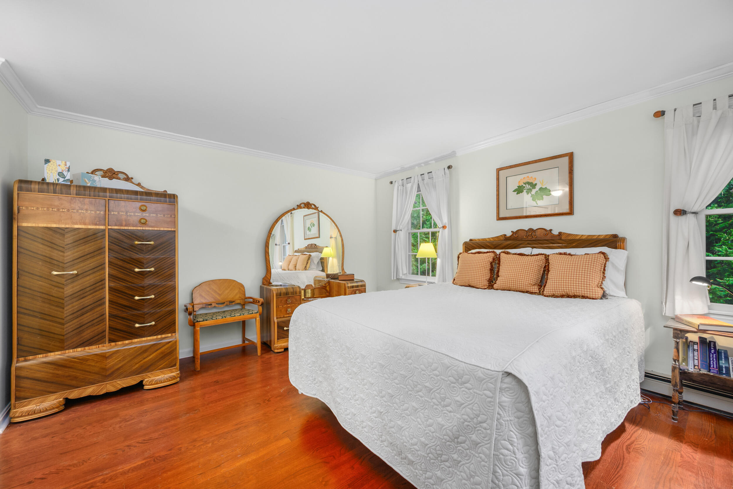 28 Lakeview Avenue Chatham, MA 02633 - Photo 23 of 63 a bedroom with a bed and a chandelier