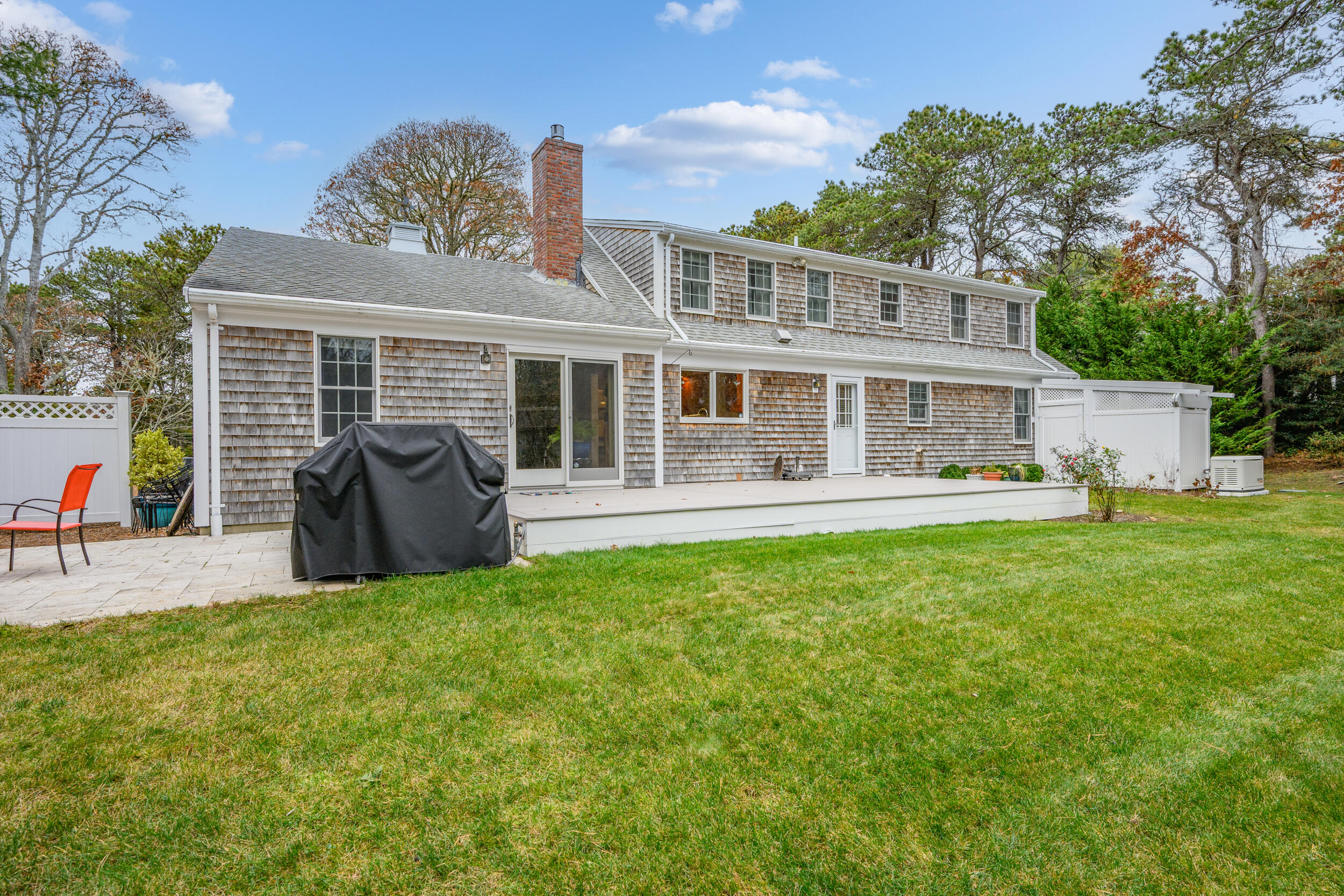 28 Lakeview Avenue Chatham, MA 02633 - Photo 35 of 63 a view of a house with a backyard and a patio