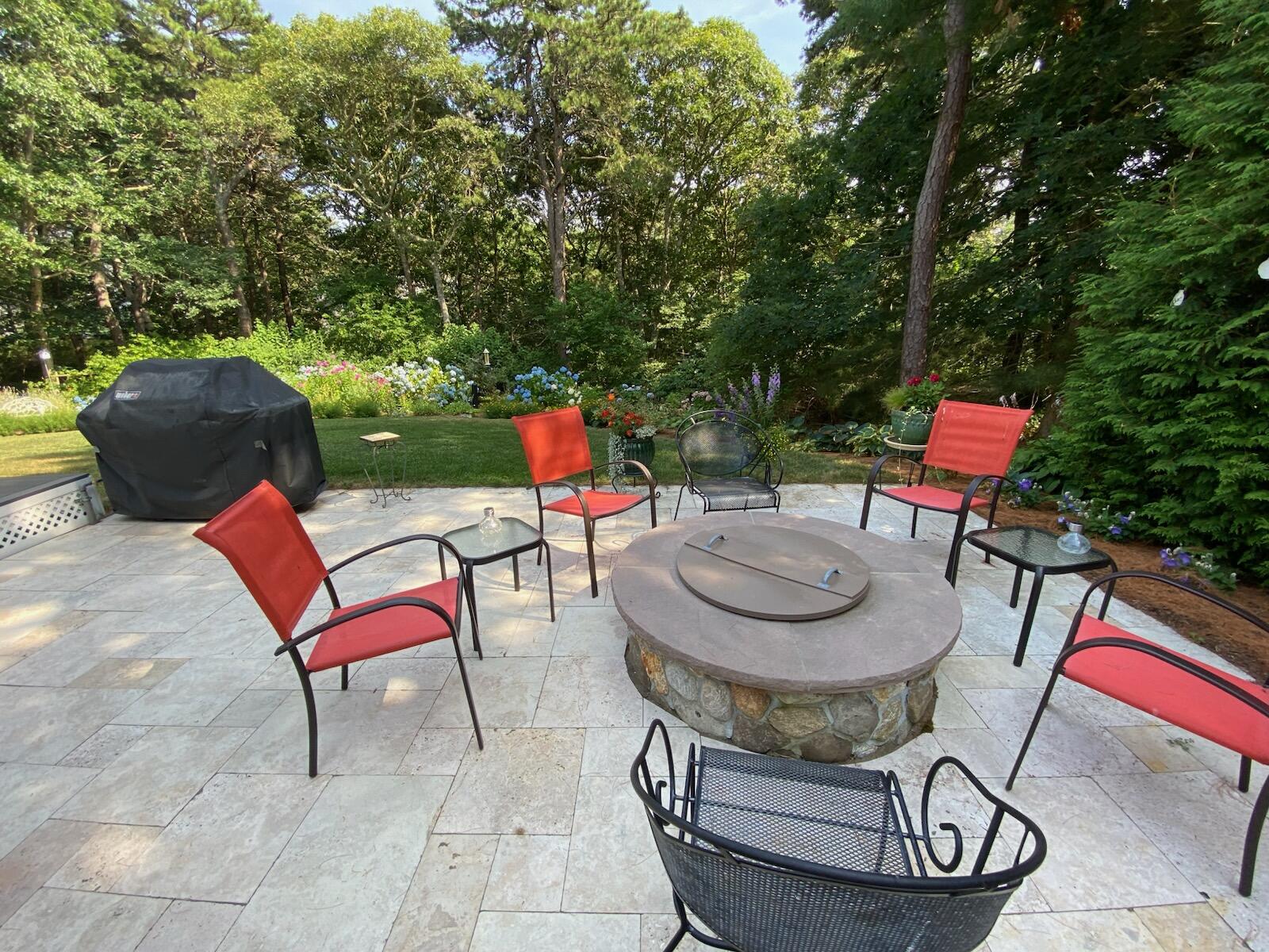 28 Lakeview Avenue Chatham, MA 02633 - Photo 42 of 63 a view of a chairs and table in backyard