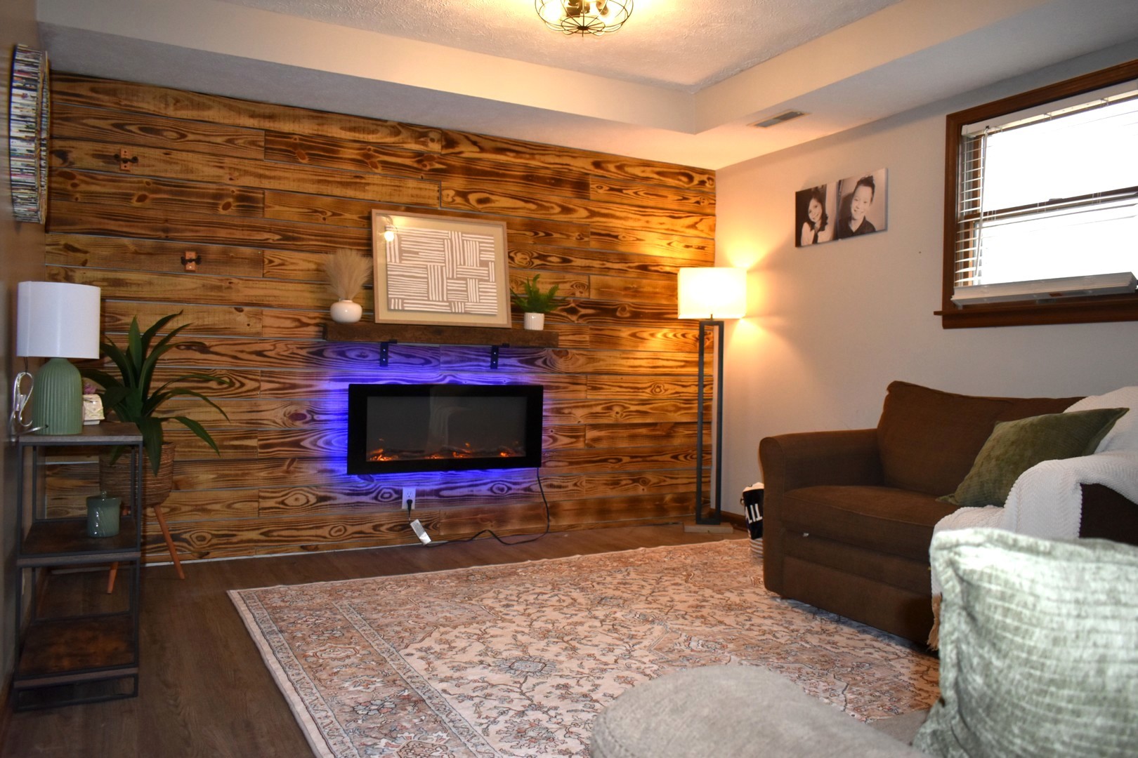 35 West 5th Street El Paso, IL 61738 - Photo 11 of 29 a living room with couches bookshelf and a flat screen tv
