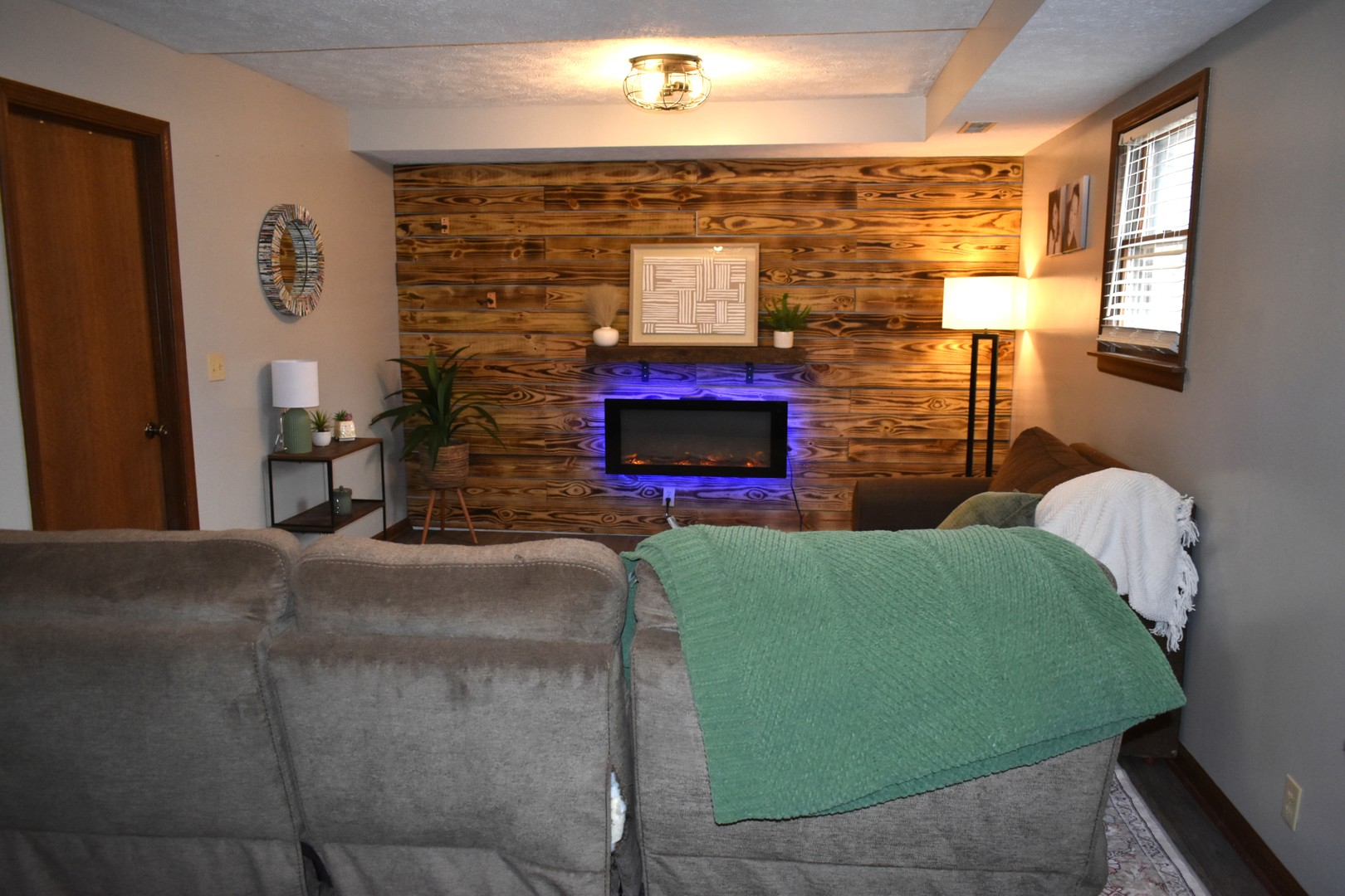 35 West 5th Street El Paso, IL 61738 - Photo 12 of 29 a living room with fireplace furniture and a flat screen tv
