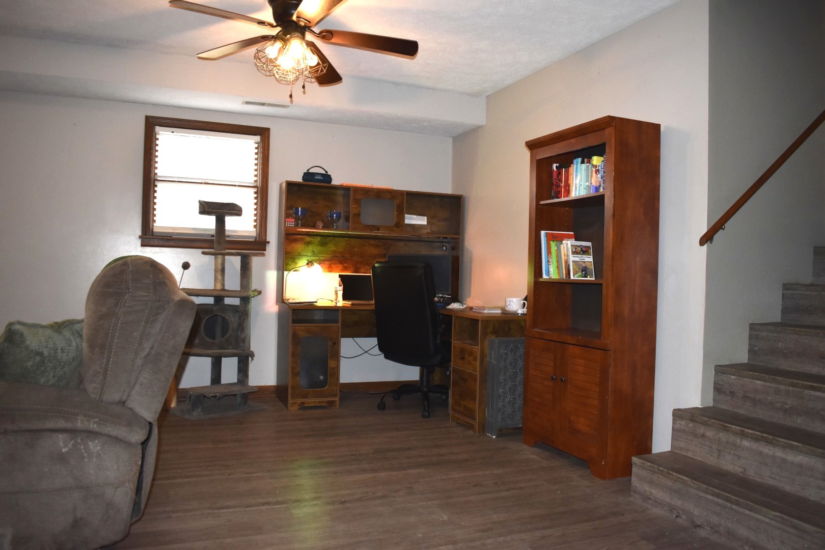35 West 5th Street El Paso, IL 61738 - Photo 16 of 29 a living room with furniture and a fireplace