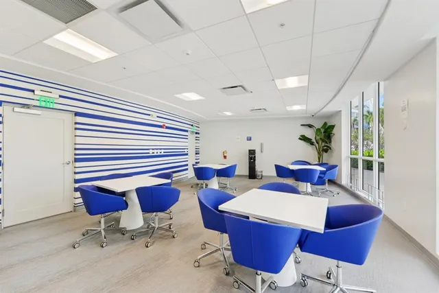 a swimming pool with outdoor seating and yard