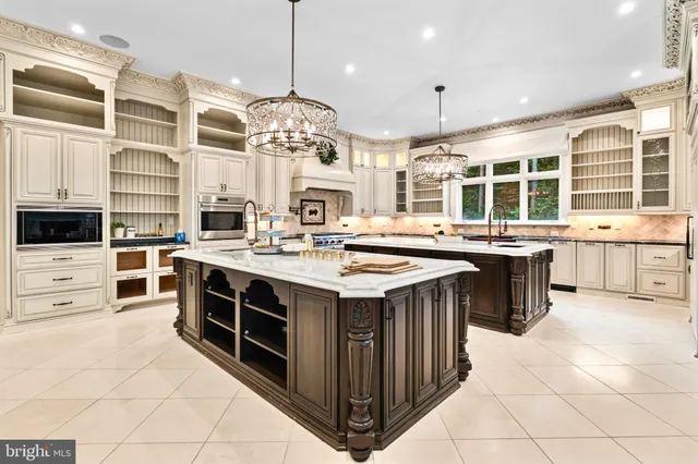 a kitchen with stainless steel appliances a stove a sink a oven and a refrigerator