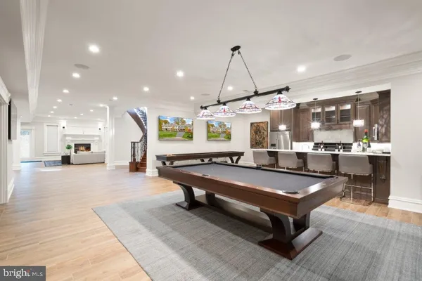 a room with lots of furniture and air hockey table