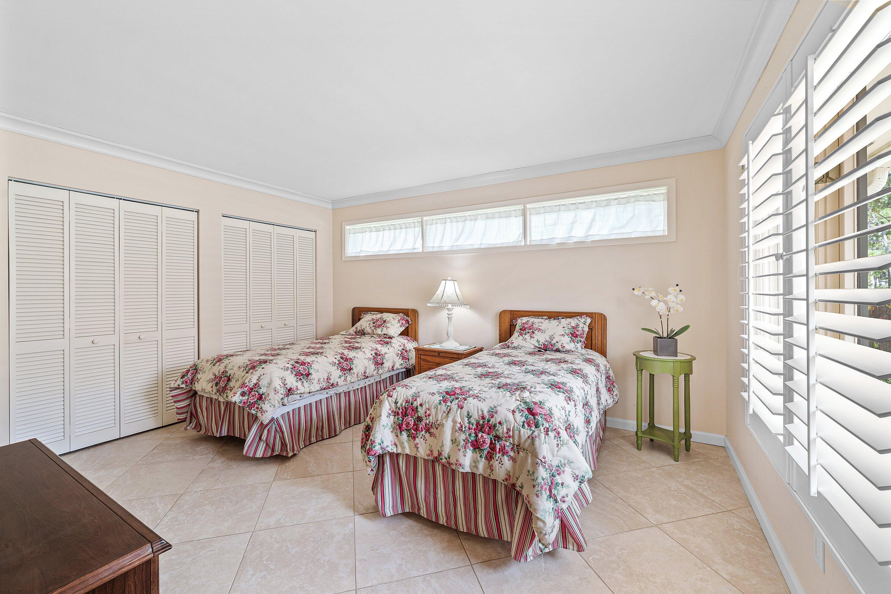 4365 Shell Drake Lane Boynton Beach, FL 33436 - Photo 24 of 56 a bedroom with two beds and a window