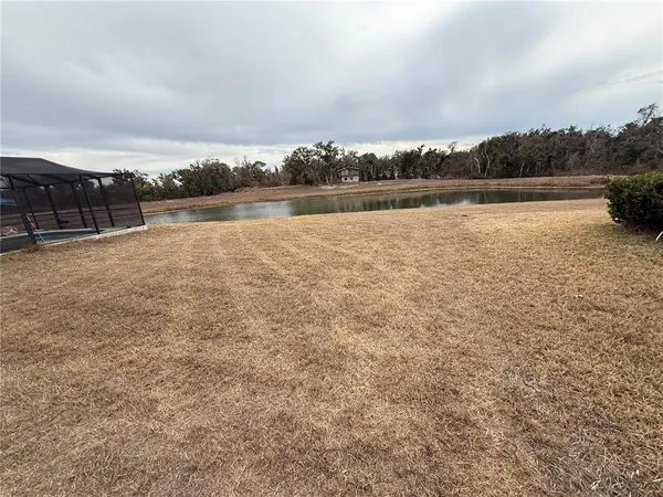 a view of a lake with houses in the back