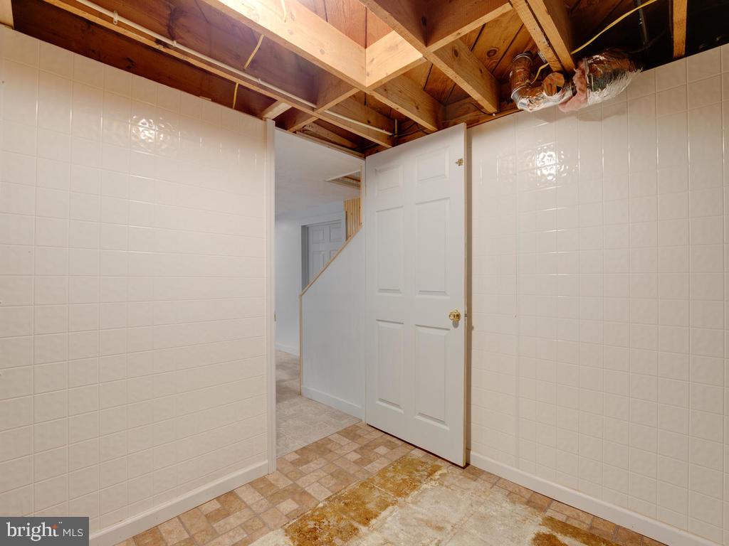 313 Charles Road Linthicum, MD 21090 - Photo 20 of 35 entrance to space behind built-in cabinetry