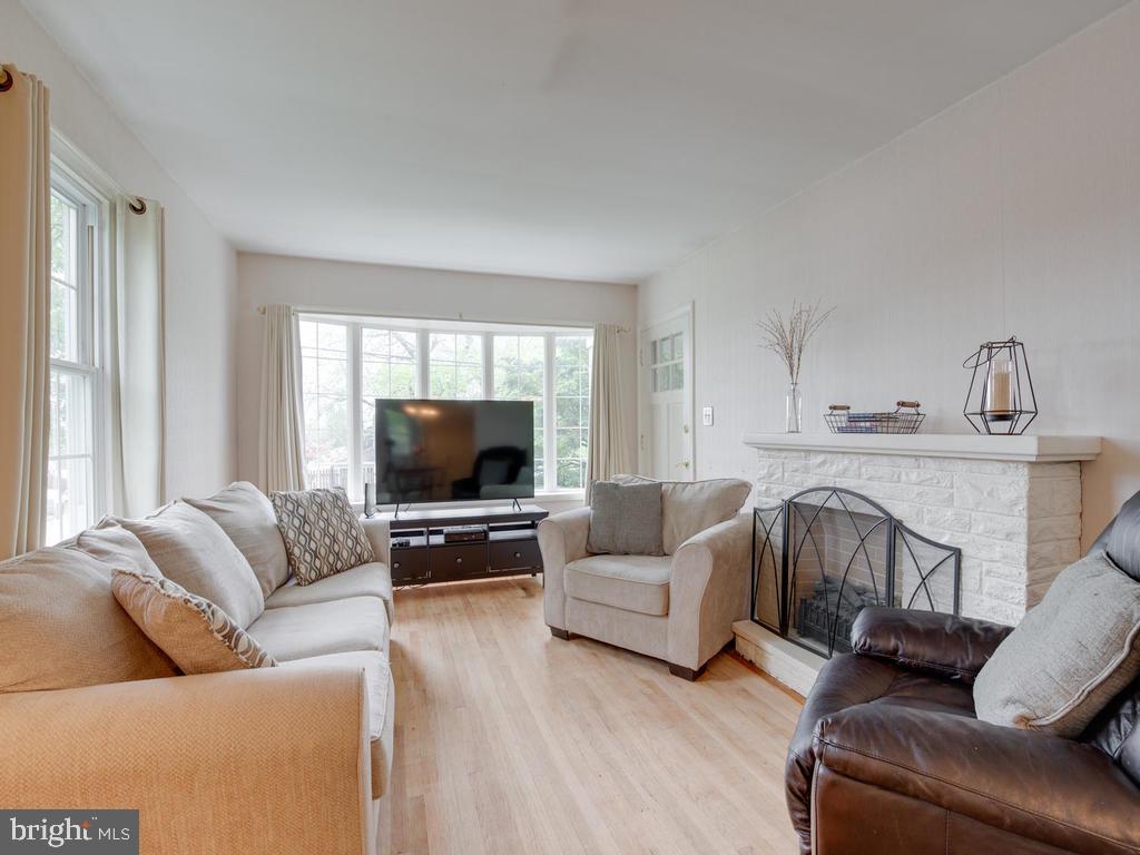 313 Charles Road Linthicum, MD 21090 - Photo 4 of 35 Bright and inviting living room with wood flooring