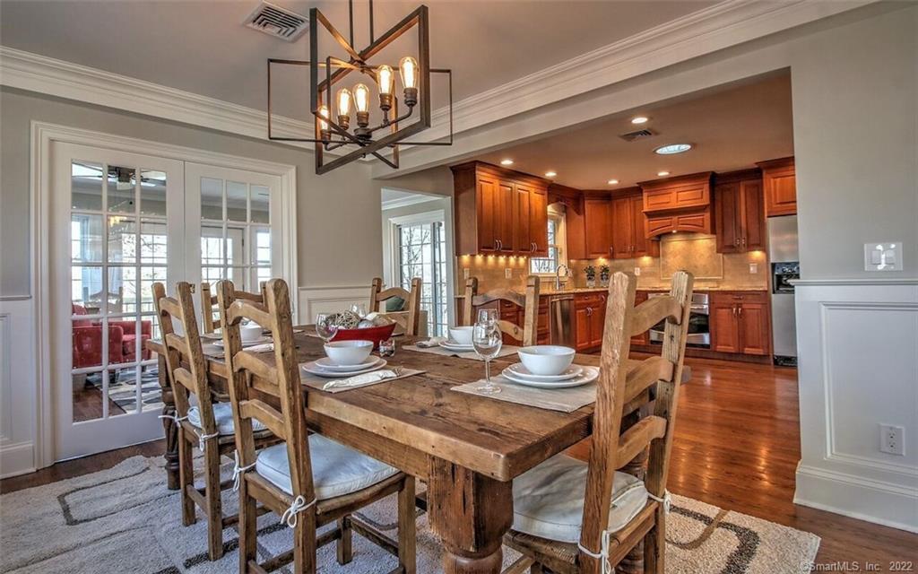 492 Lockwood Road Fairfield, CT 06825 - Photo 1 of 1 a view of a dining room with furniture window and wooden floor