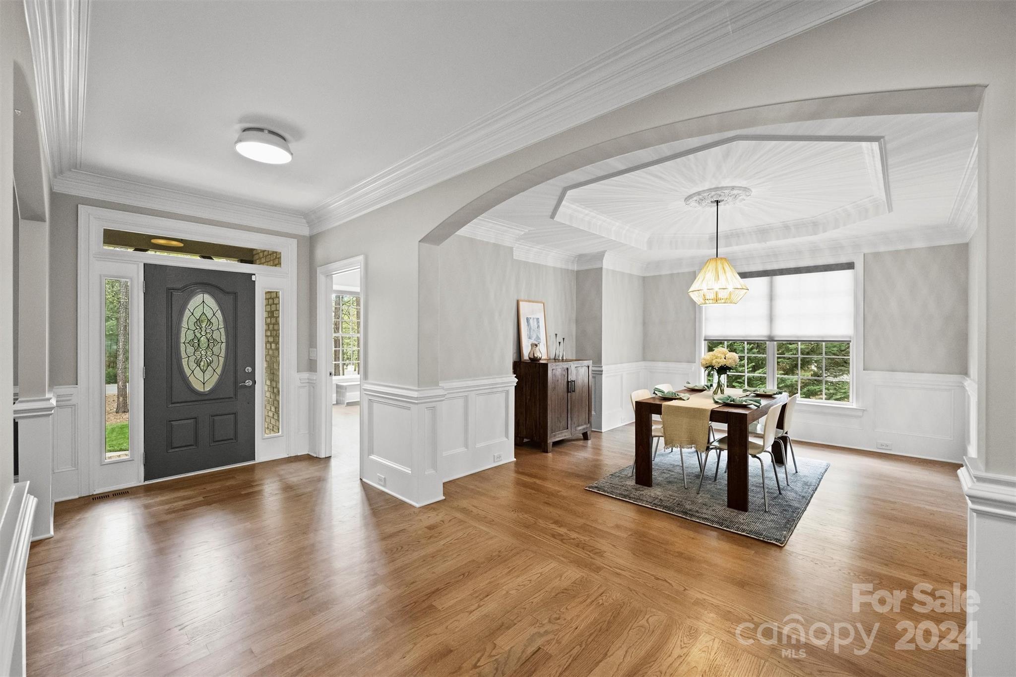 7019 Montgomery Road Lake Wylie, SC 29710 - Photo 11 of 48 a view of a dining room with furniture window and wooden floor