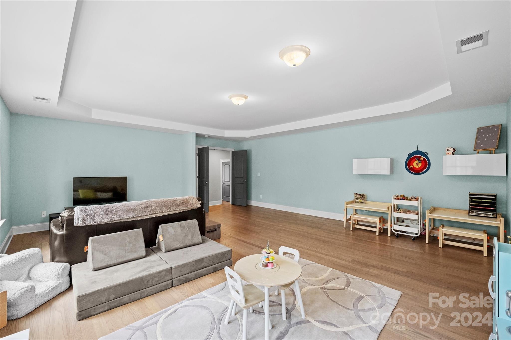 7019 Montgomery Road Lake Wylie, SC 29710 - Photo 29 of 48 a living room with furniture and a wooden floor