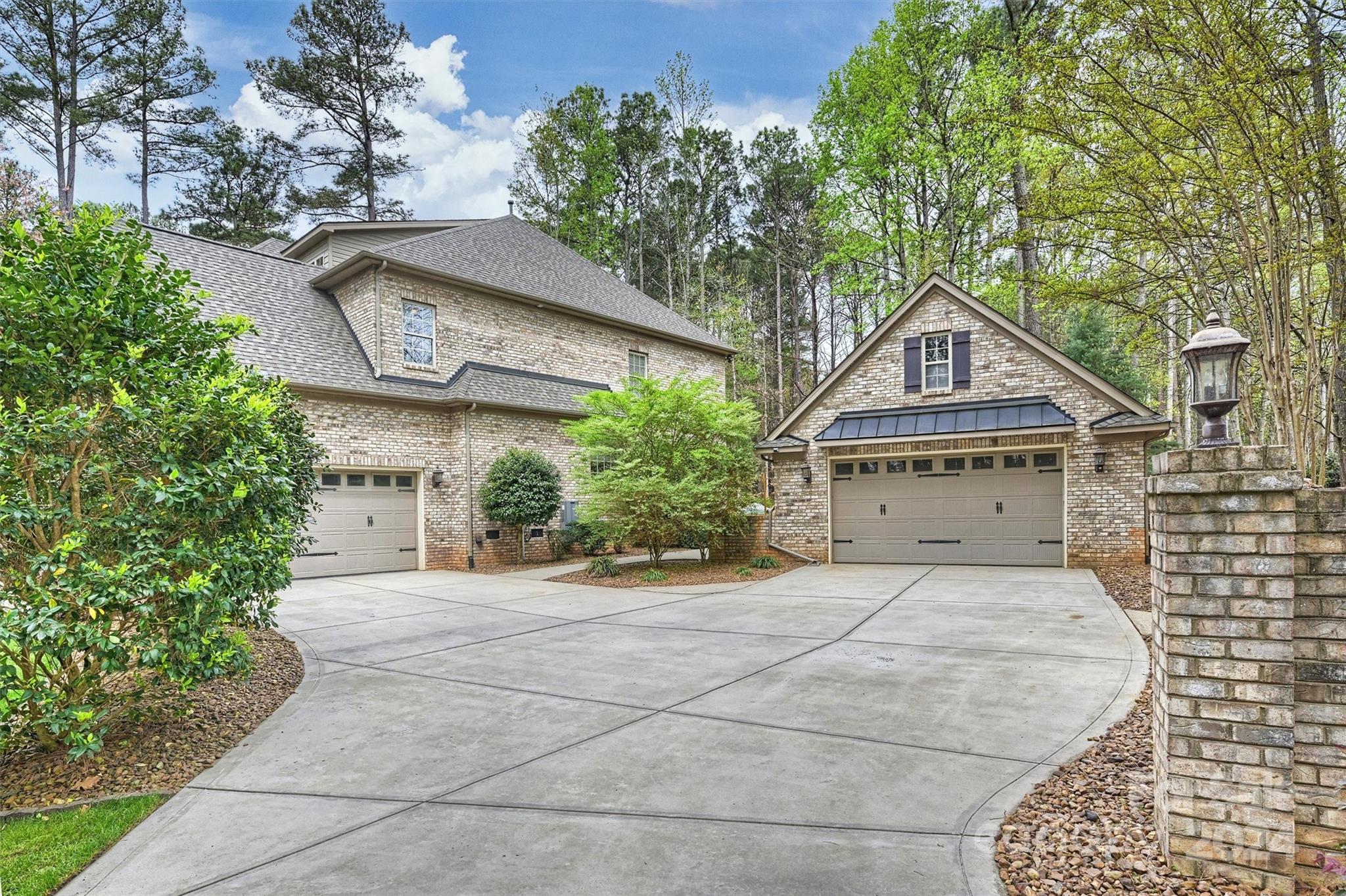 7019 Montgomery Road Lake Wylie, SC 29710 - Photo 44 of 48 a house with trees in front of it