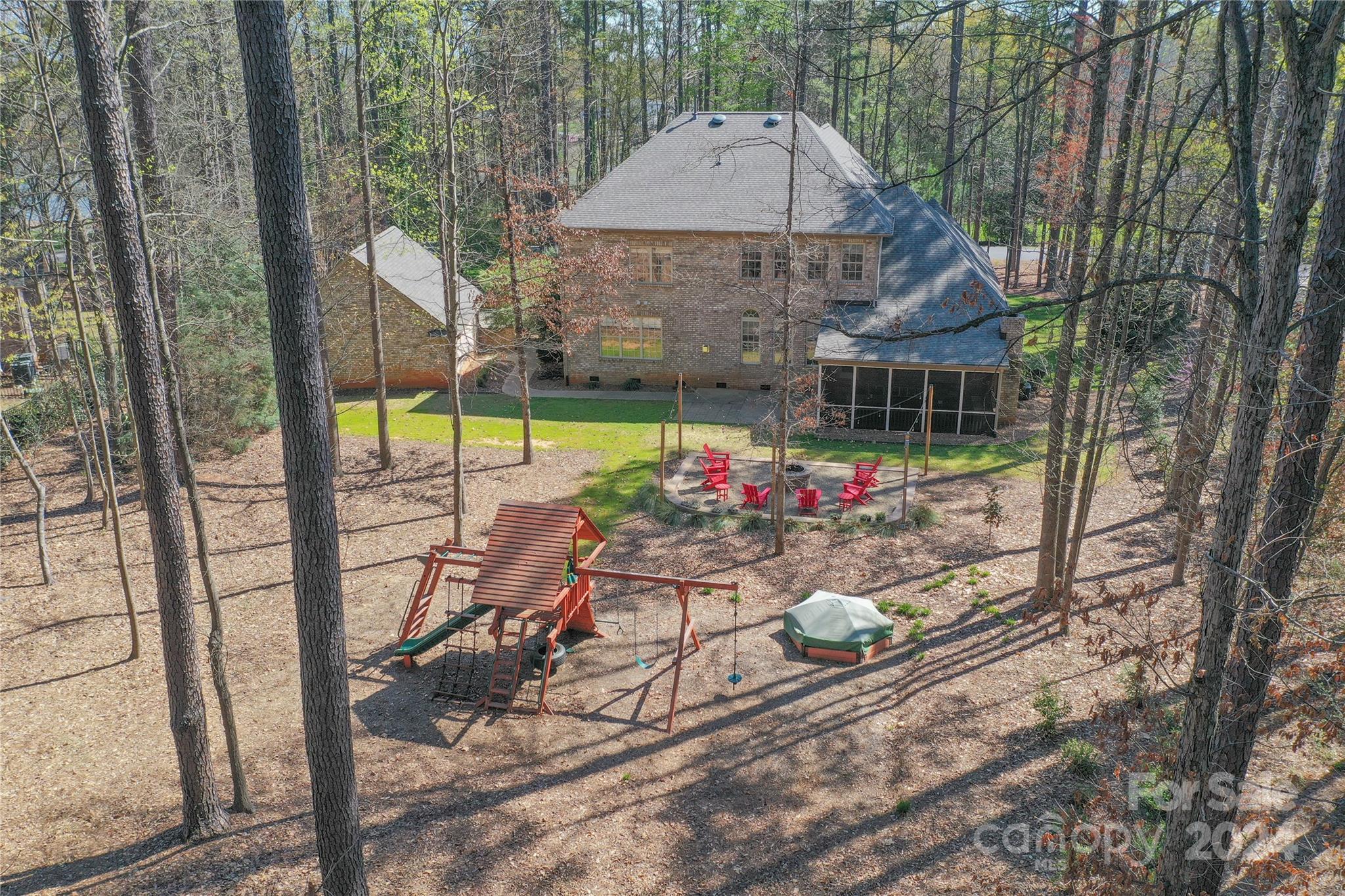 7019 Montgomery Road Lake Wylie, SC 29710 - Photo 47 of 48 a view of a chairs and table in backyard