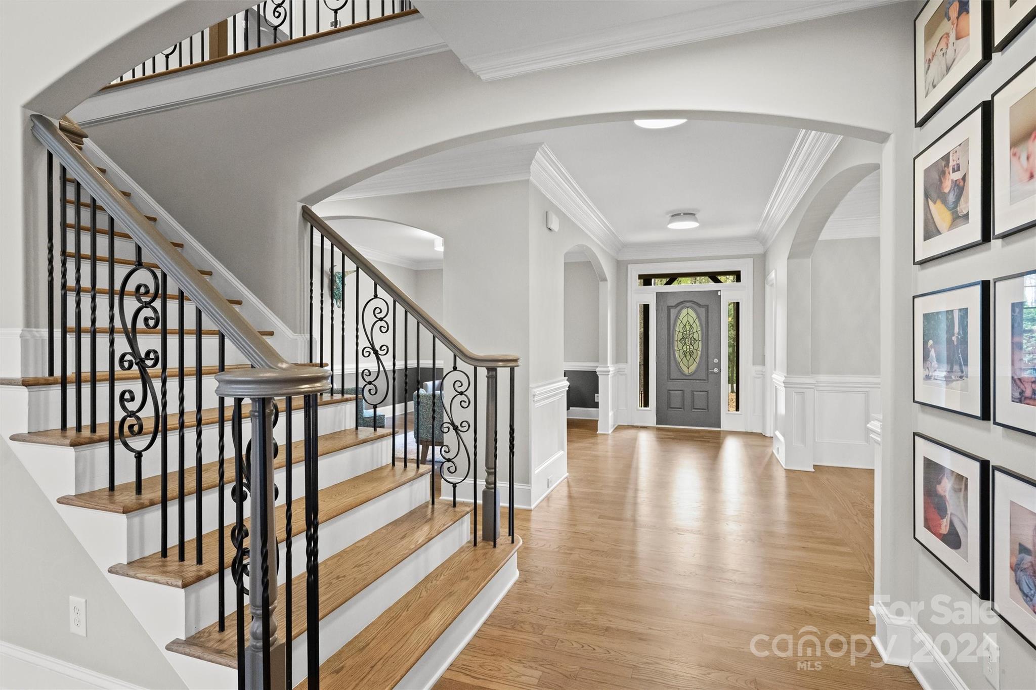 7019 Montgomery Road Lake Wylie, SC 29710 - Photo 6 of 48 a view of an entryway with wooden floor and stairs