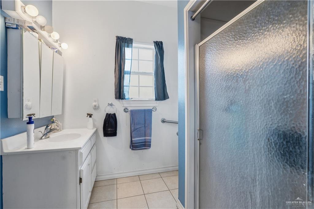 1315 Rio Comal Circle San Juan, TX 78589 - Photo 12 of 16 a bathroom with a sink and a mirror