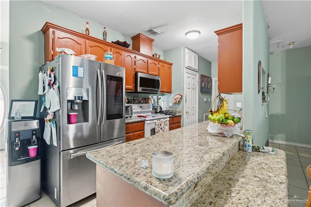 1315 Rio Comal Circle San Juan, TX 78589 - Photo 4 of 16 a kitchen view of a refrigerator and a sink