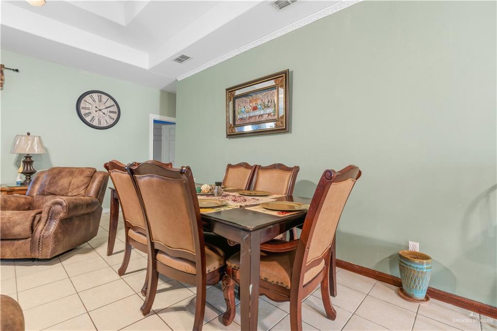 1315 Rio Comal Circle San Juan, TX 78589 - Photo 6 of 16 a dining room with furniture and a lamp