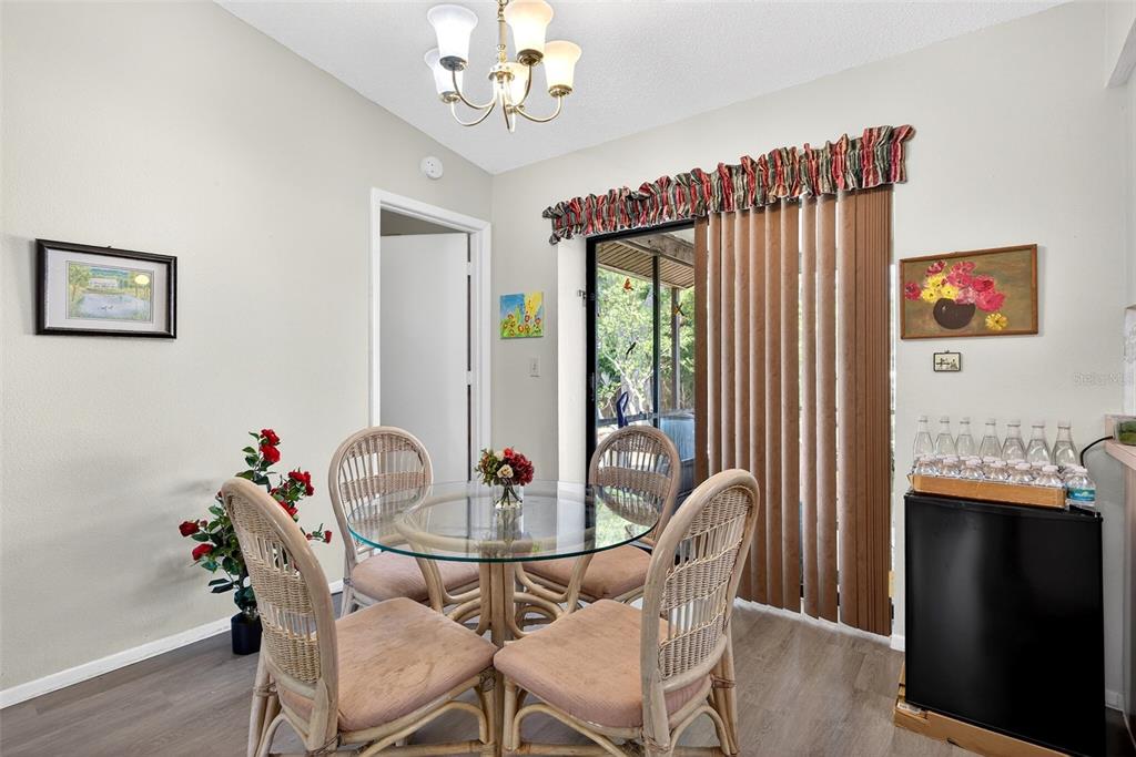 464 Coronado Road Venice, FL 34293 - Photo 5 of 28 a view of a dining room with furniture window and wooden floor